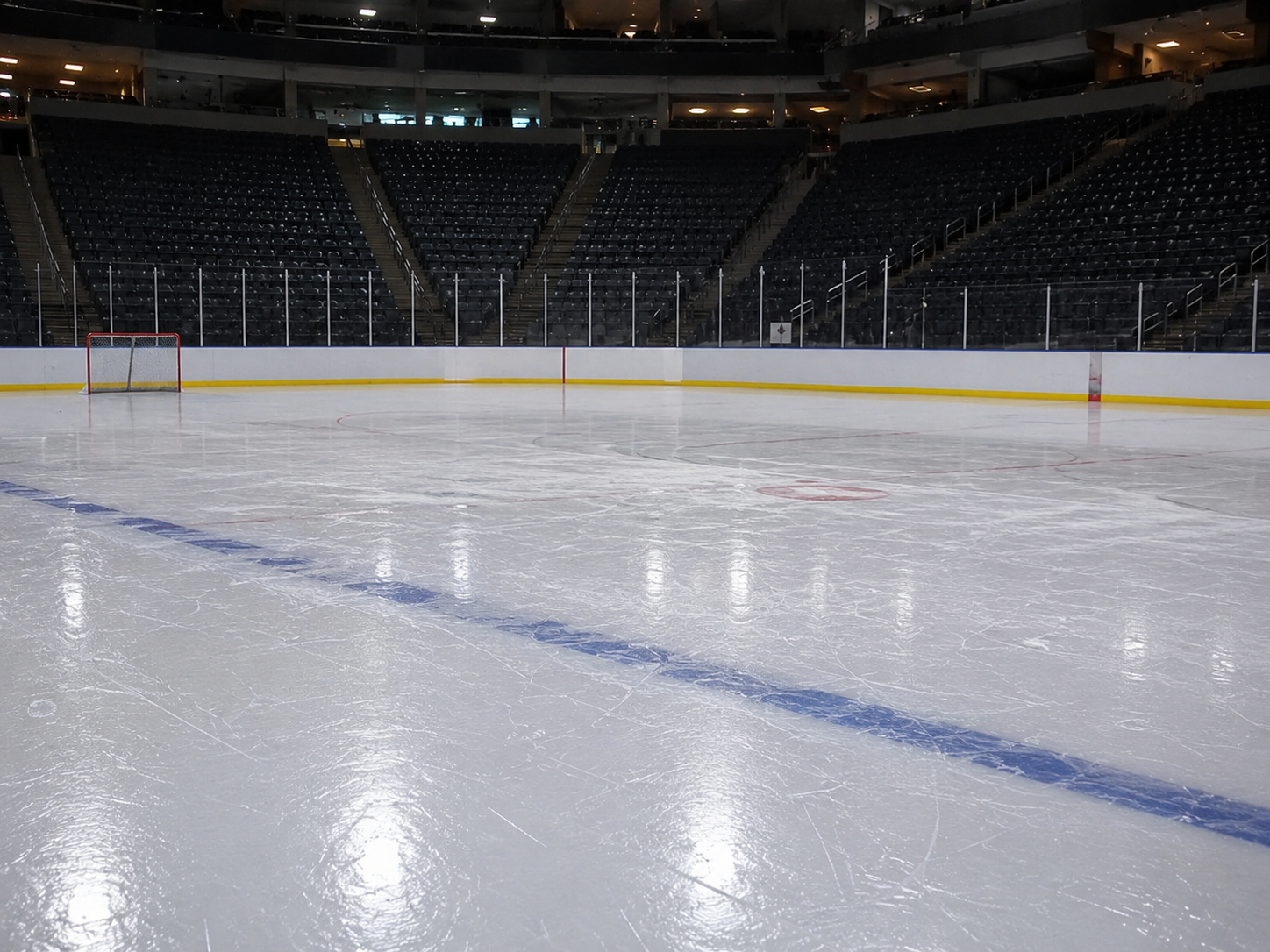 An empty hockey rink after a playoff game.