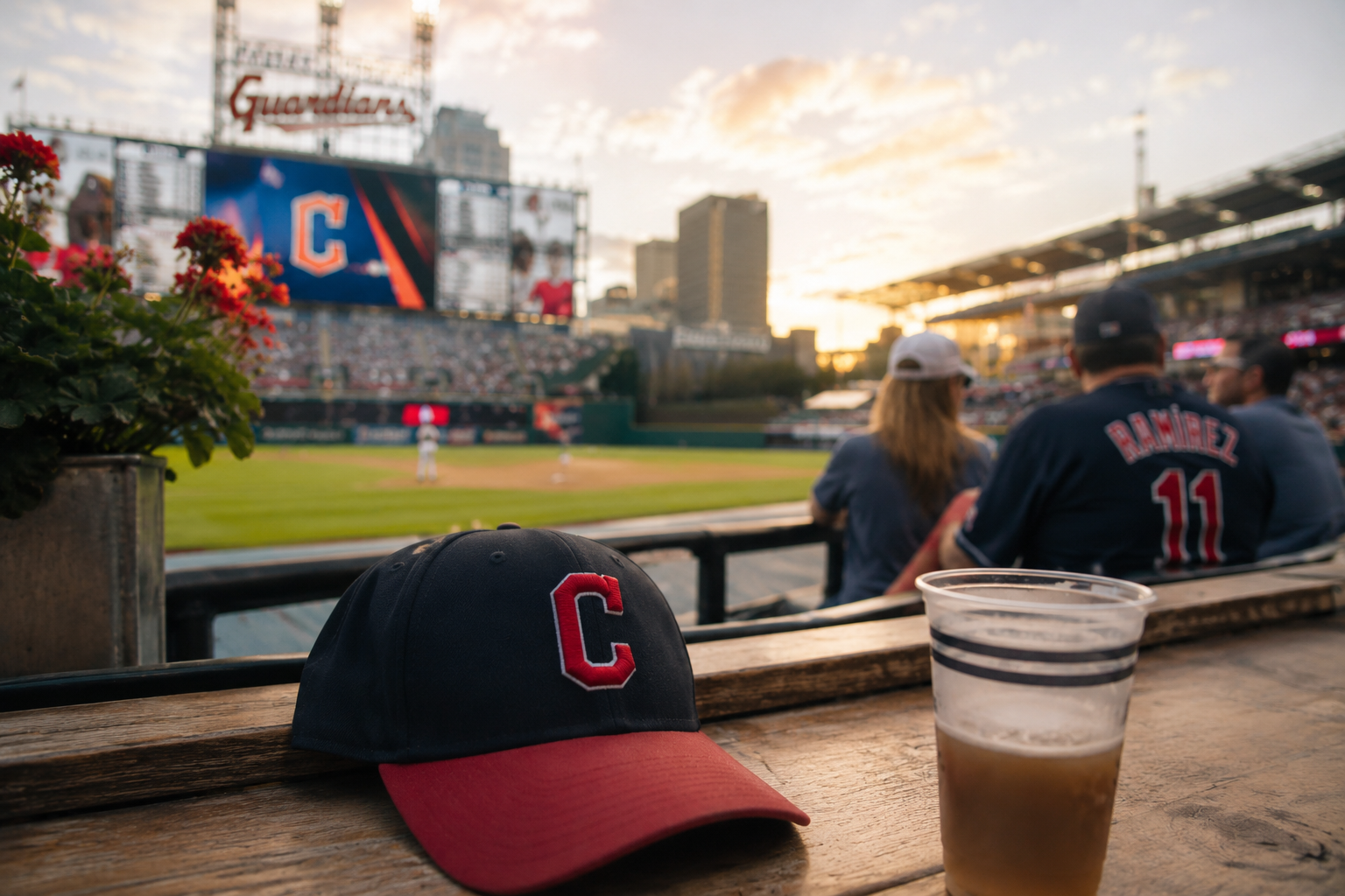 A baseball glove and lineup card sit on a dugout bench after a game.