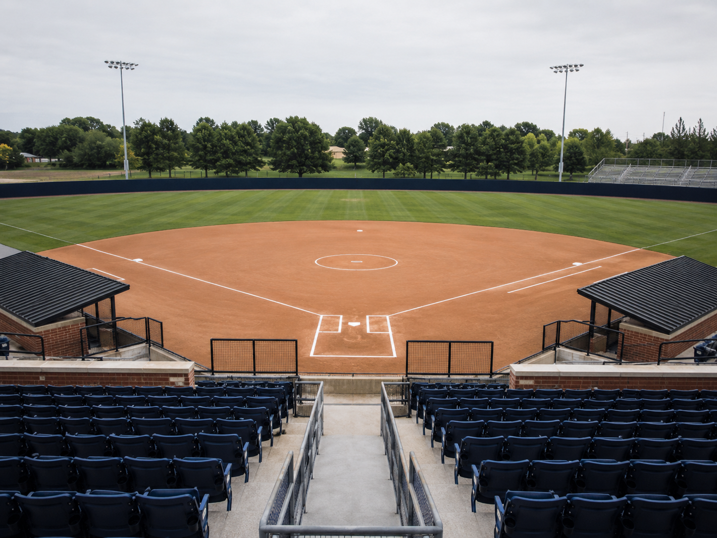 An empty college softball field before a tournament game.