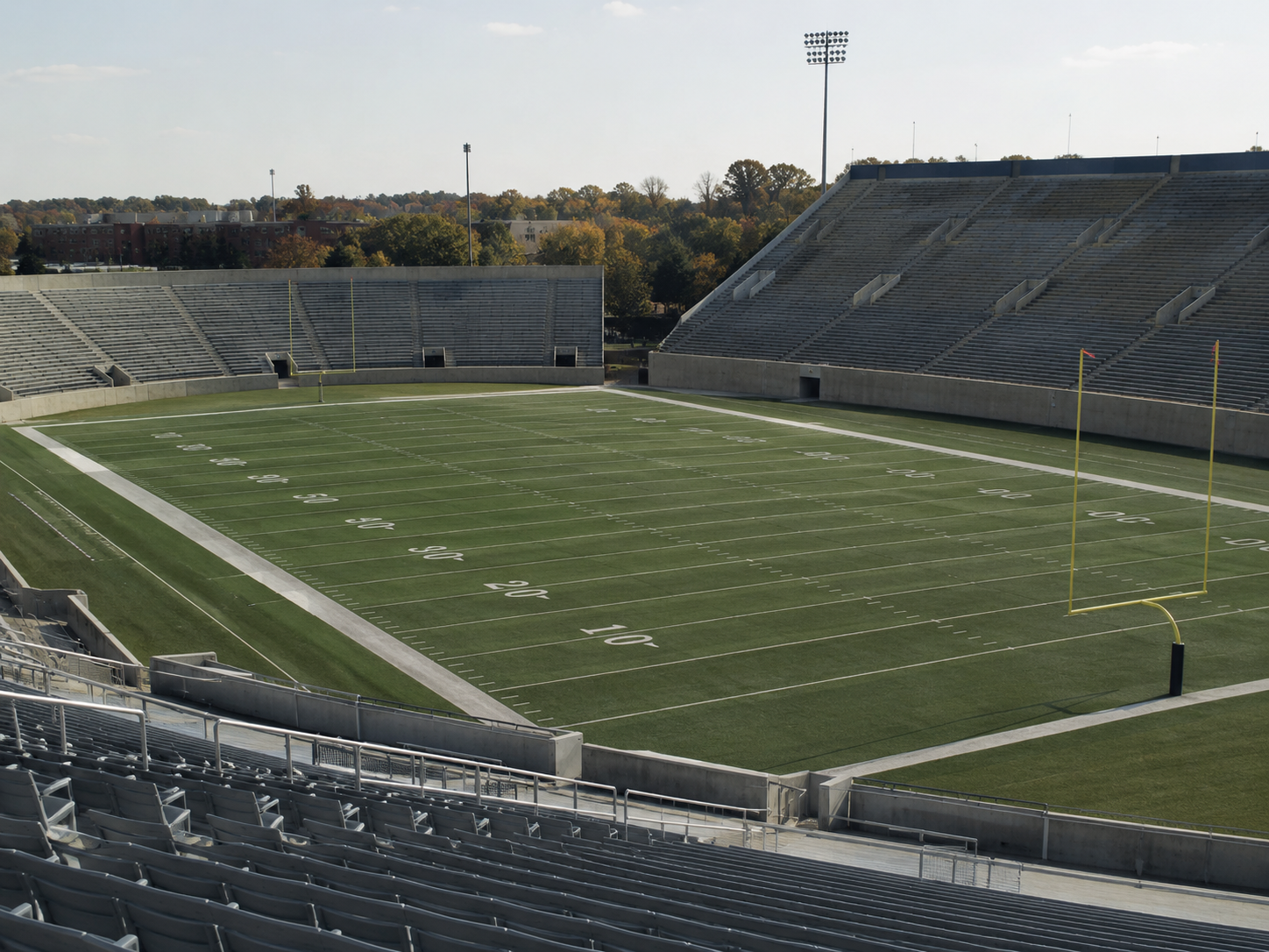 An empty college sports venue viewed from the stands.