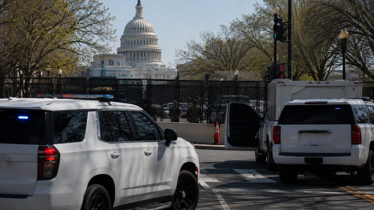 Federal law enforcement vehicles near a secured government perimeter in Washington, D.C.