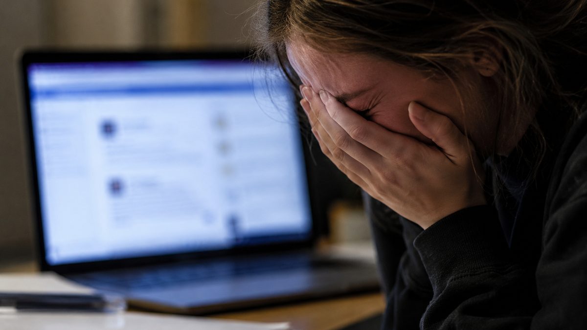 A smartphone and laptop arranged to suggest online privacy and safety.