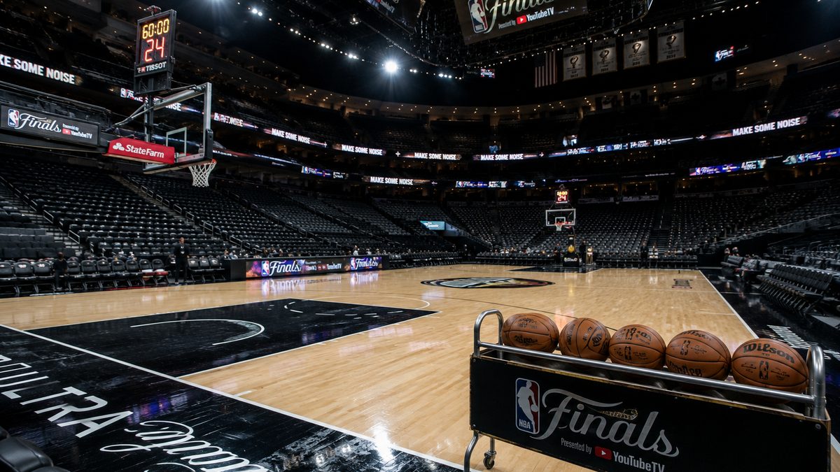 Empty basketball arena court before a championship game.