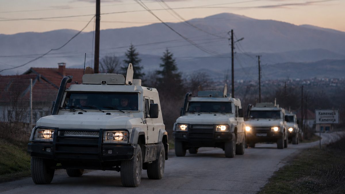 Peacekeeping vehicles travel along a quiet road in a mountainous Balkan setting.